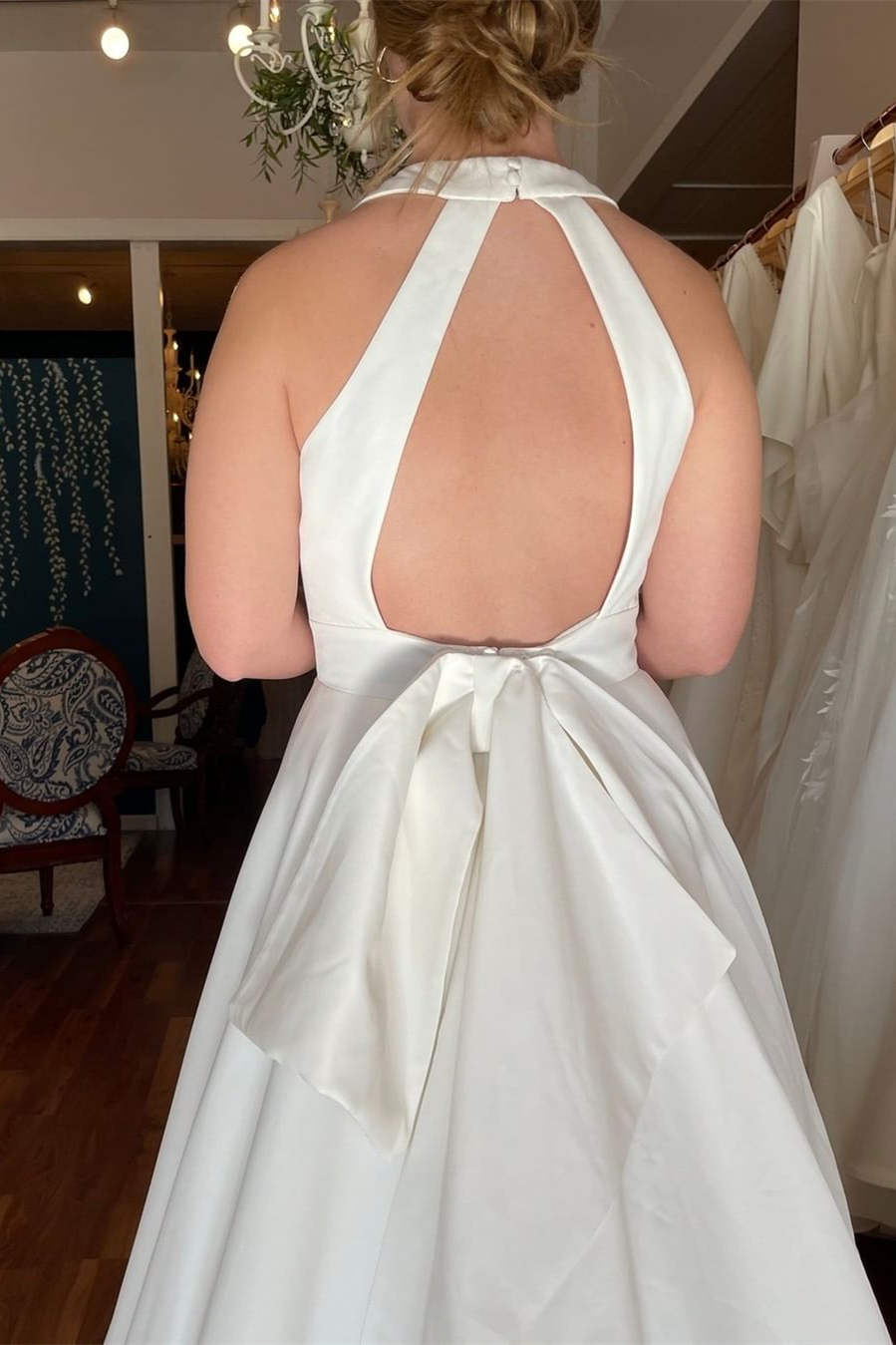 Elegant Ivory Plunging Halter Mermaid Style Bridal Dress with Functional Pockets