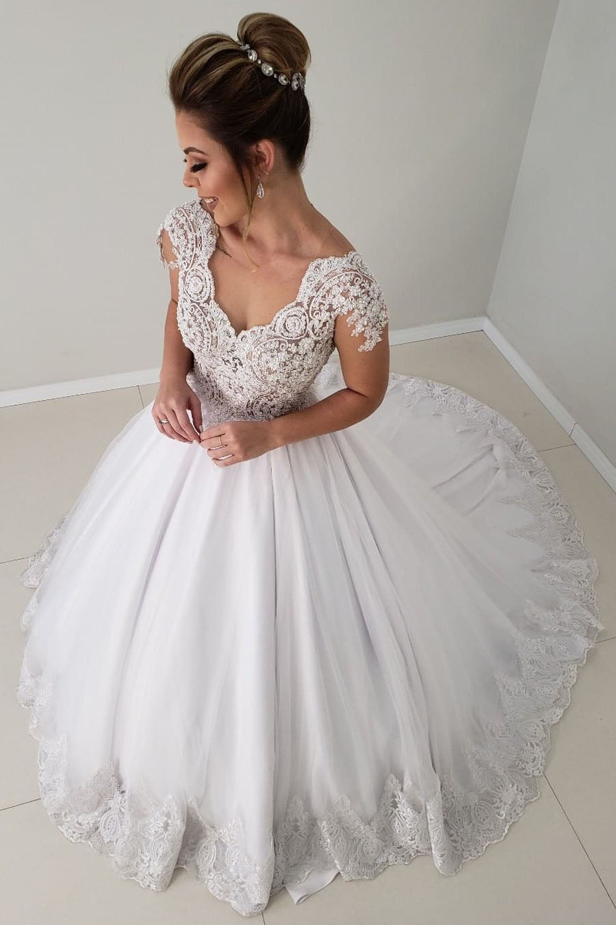 Elegant Princess A-line White Wedding Dress with Cap Sleeves and Lace